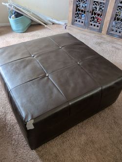 Dark brown vinyl ottoman