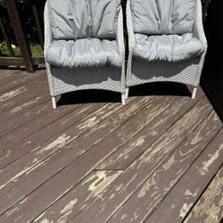 Two White Wicker Chairs With Cushions