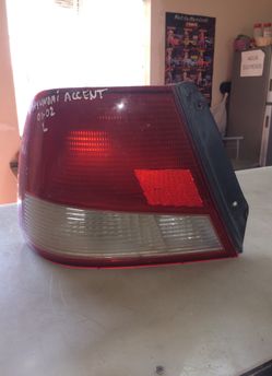 00-02 Hyundai accent hatchback tail light LH