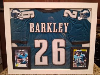 SAQUON BARKLEY OF THE PHILADELPHIA EAGELS CUSTOM STITCHED, FRAMED JERSEY.