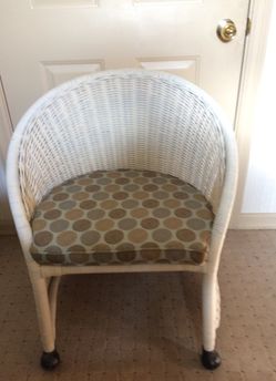 Antique white wicker rolling chair