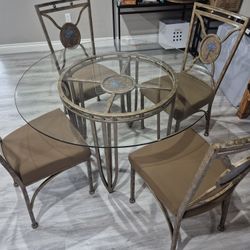 48"// Glass Top and Metal Frame Table With 4 Chairs In Very Good Condition 