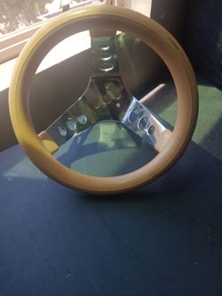 Vintage style gold donut steering wheel.