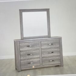 Ollie Grey king size bed and six dresser drawer with mirrow