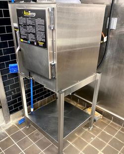 2018 AccuTemp Evolution Boiler-Free Commercial Steamer on stainless stand. 208V Single Phase unit. Powered on successfully. Unit displayed low water n