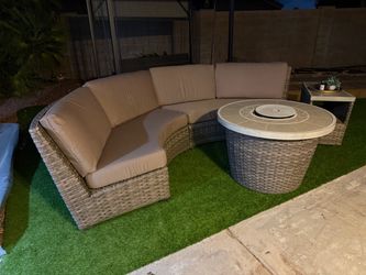 Patio sofa with 1 side table and a firepit