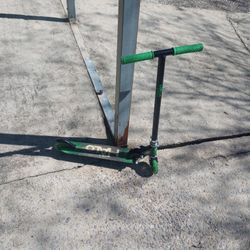 Rise Above Supreme Inline Scooter in green and black. 