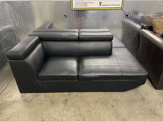 Black couch with moveable headrests