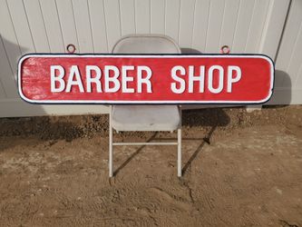 Hand-Carved Barber Shop Sign – $250