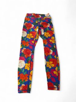 We Wore What floral leggings with red, yellow, and white flowers on a blue background, size S