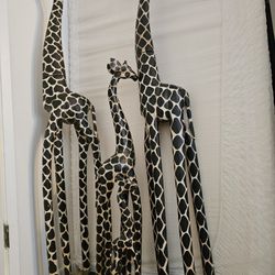 A Family Of Giraffe Statues