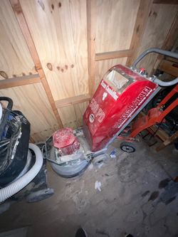 Concrete grinder with vacuum