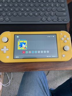 Nintendo switch lite yellow with sonic game and charger