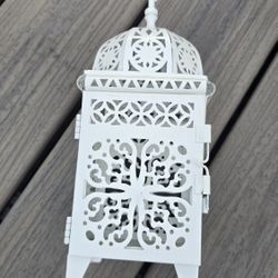 Small Beautiful Lantern Candle Holder 4" x 4" x 11" H

Bottle water in the pictures is not included. It is there for sizing. 
San Jose 95121