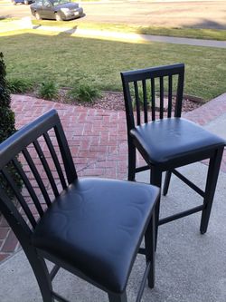 Two bar chairs, Dark coffee with black upholstery.