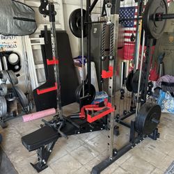 4 post rack / smith machine with cables.  Bench included with accessories and 235lbs weight. $650