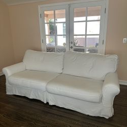 White Slipcovered Sofa Set ($500 Each)