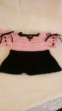 Baby girl dress, hand crafted, made with cotton yarns, new, fits 6months and up, has 3 black buttons on the back.