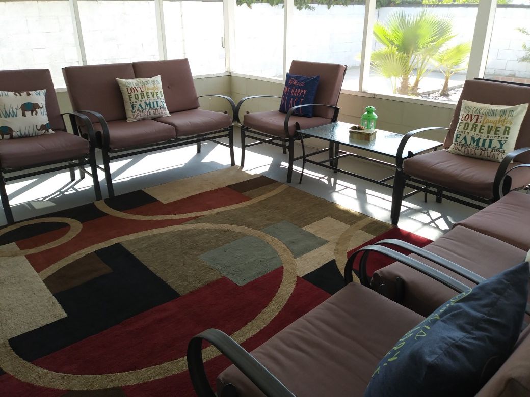 7 pieces Patio furniture and rug.