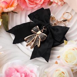 Black bow keychain with gold bow and pearl