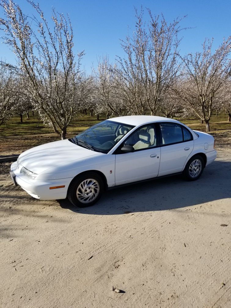 99 Saturn sl2.SMOGGED, CLEAN TITLE. 150000 MILES