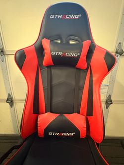 GTRACING red gaming chairs feature a racecar-inspired design with an ergonomic metal frame that contours to the spine