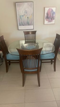 Glass top table with 4 chairs