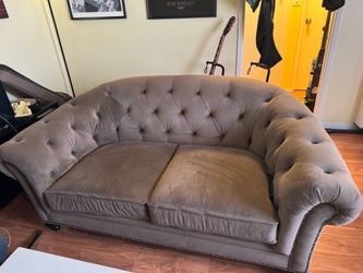 Brown suede love sofa