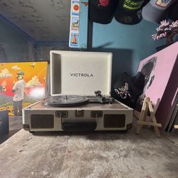 Victrola Journey or Venture portable Bluetooth suitcase record player. 