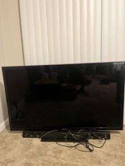 55 inch Samsung LED w/ LG soundbar and Roku streaming device.