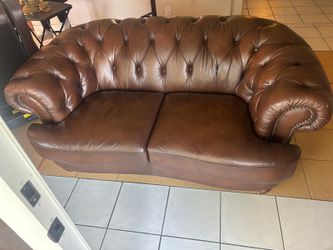 Studded  brown leather two seater couch brown…62” wide , 38” depth , 30 “ high $100