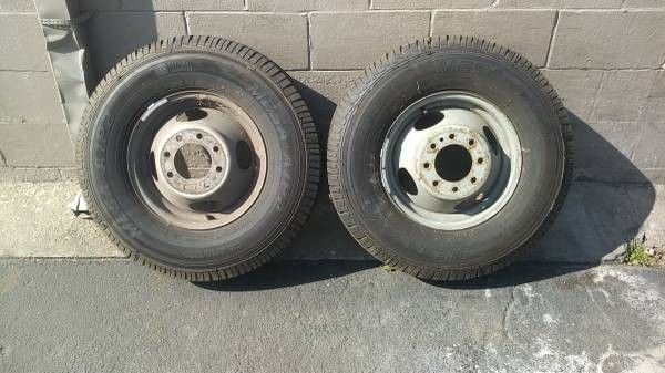 Two chevy or gmc 16 inch dually wheels with new tires