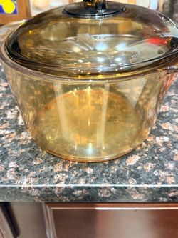 brown PYREX covered casserole dish
