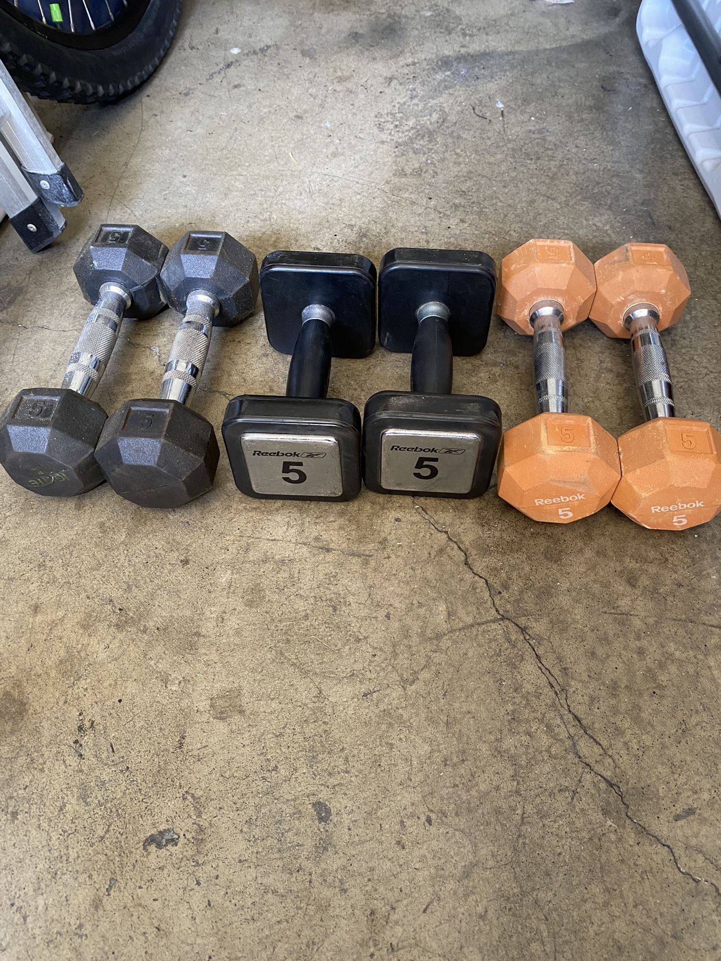 Three sets of dumbbells