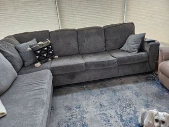 Sleeper sofa, linens and area rug