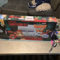Super Nintendo SNES In Boxes With Games. 