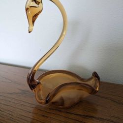 Gorgeous hand blown glass in shape of lovely Swan. Wonderful delicate collectible art specimen in a unique orange transparent color.