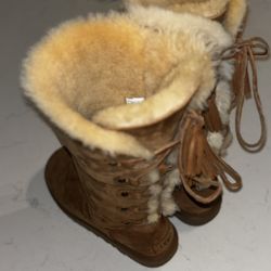 UGG Kristabelle boots in a brown color with lace-up details and sheepskin fur