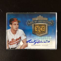 2005 Upper Deck Baseball Card Class Of Cooperstown Autograph & Game Used Bat Piece Card #10/15 Of Louis Aparicio