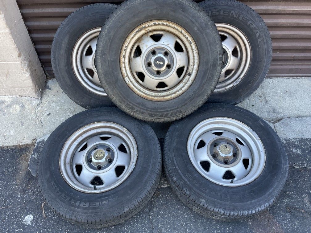 Five steel 15 inch wheels and caps for Jeep and more. 5 on 4.5 inches
