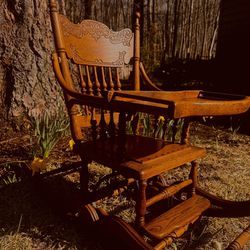 Antique Tiger Oak Convertible Pressed Back High Chair, Rocking chair, and Stroller in one.