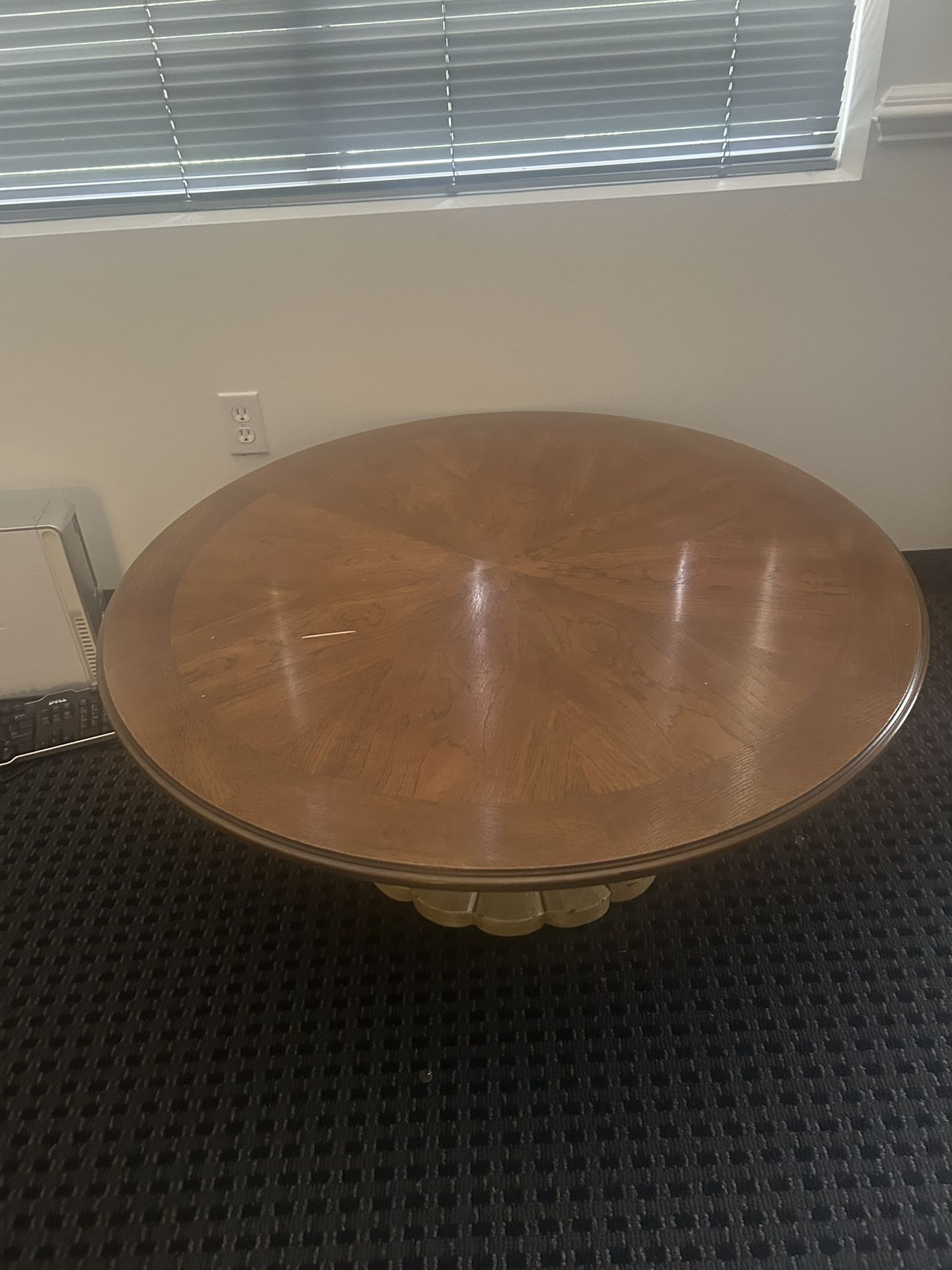Round Coffee Table With Ornate Lighter Colored Bottom