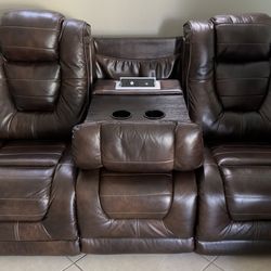 Ashley Furniture Faux Leather Power Reclining Sofa in Dark Brown