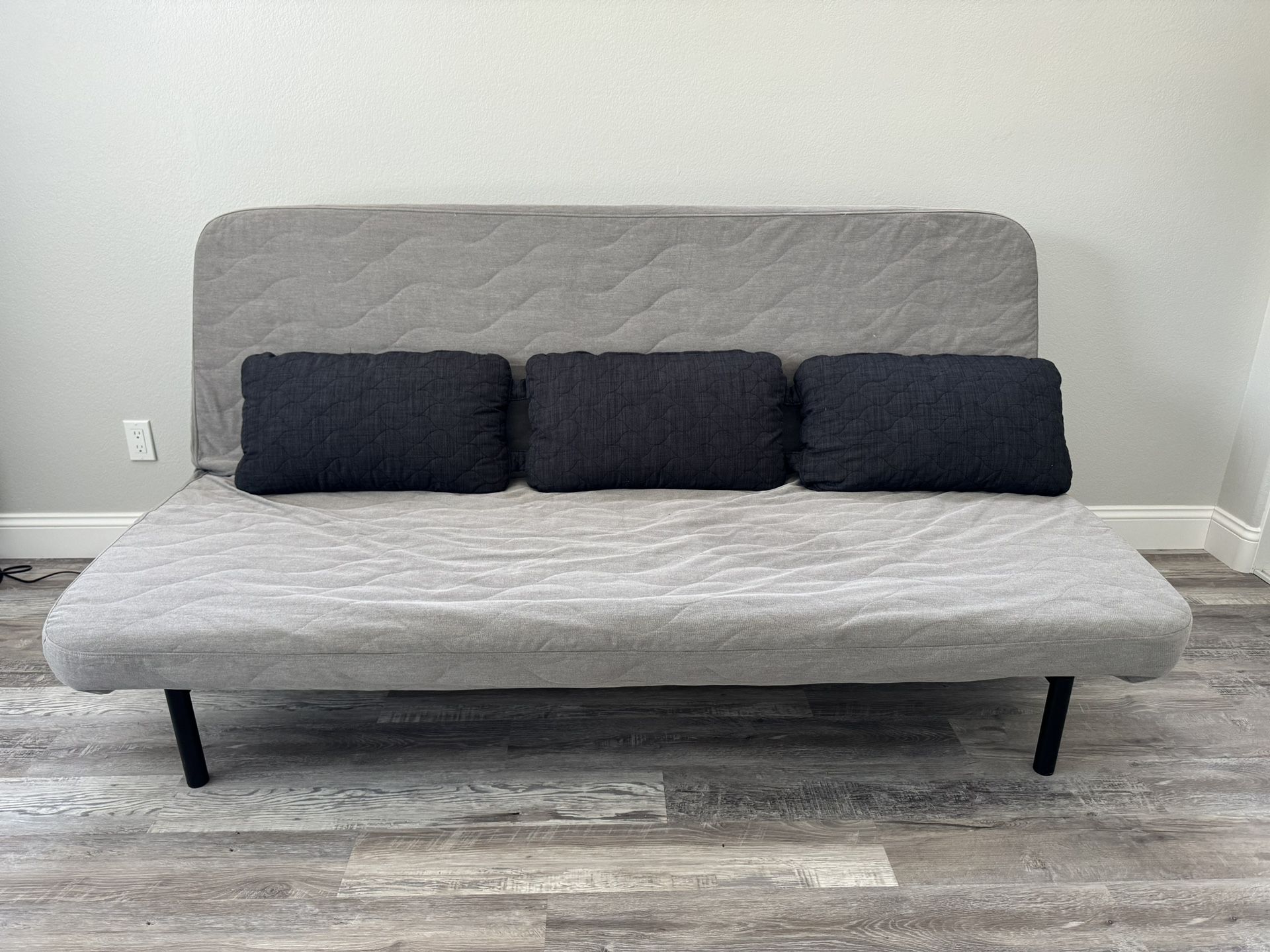 Gray Sleeper Sofa Futon with Black Pillows