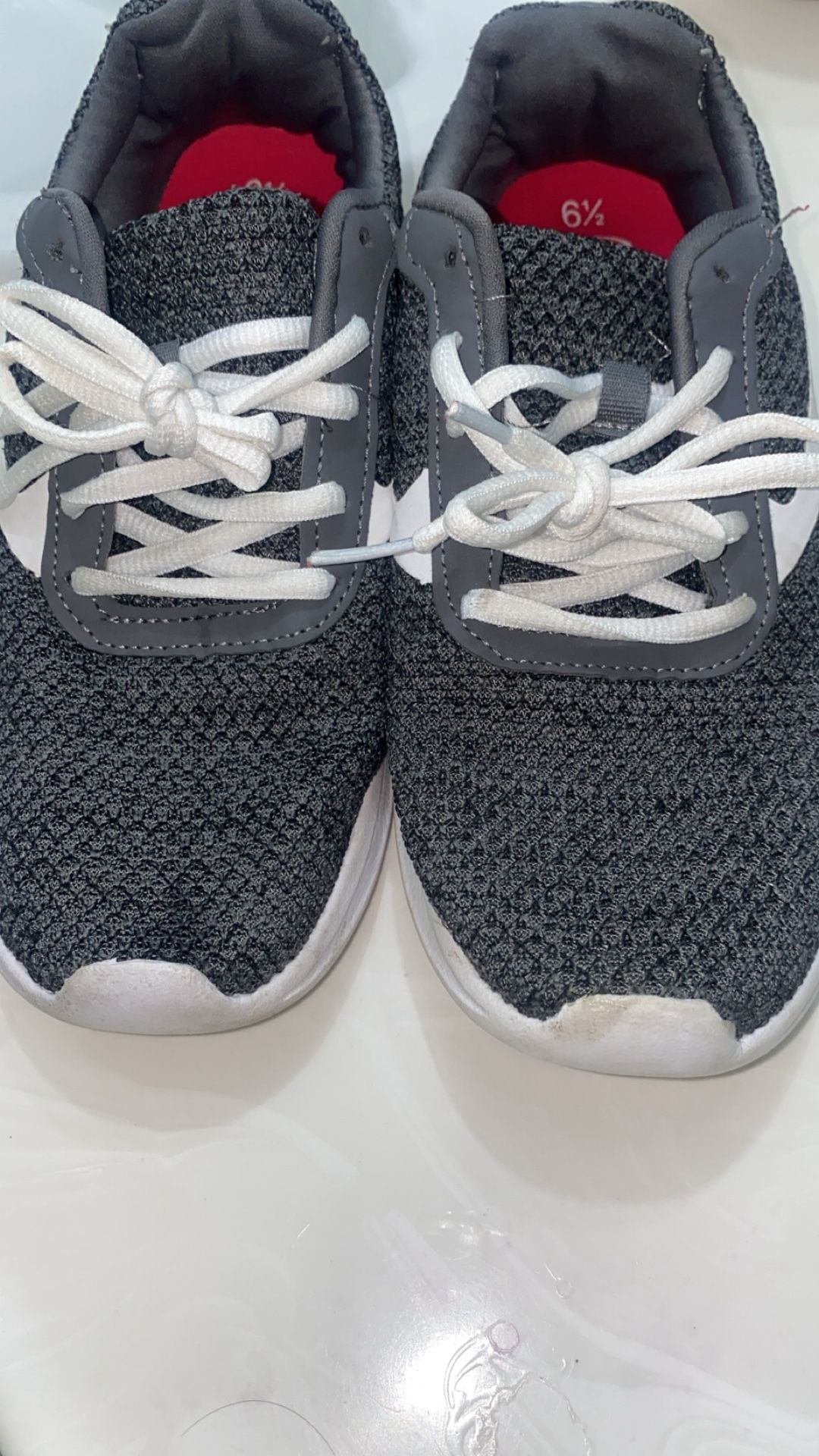 pair of gray Athletic Works mesh jogger sneakers with white laces.
