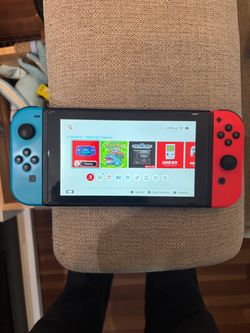 Nintendo Switch with two joy cons and games