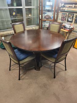 Heavy wood table with 4 chairs and reverseable top