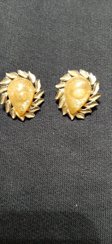 Unique Gold tone clip-on earrings leaf design.