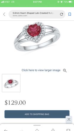 Heart shaped ruby and diamond accent ring
