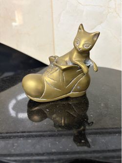 Vintage solid brass figurine of a cat sitting inside a boot